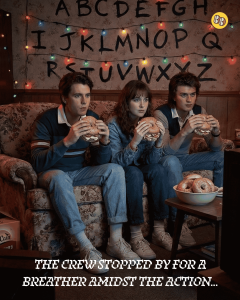 Stranger Things crew sitting on a retro couch in an 80s-style living room eating bagel sandwiches.