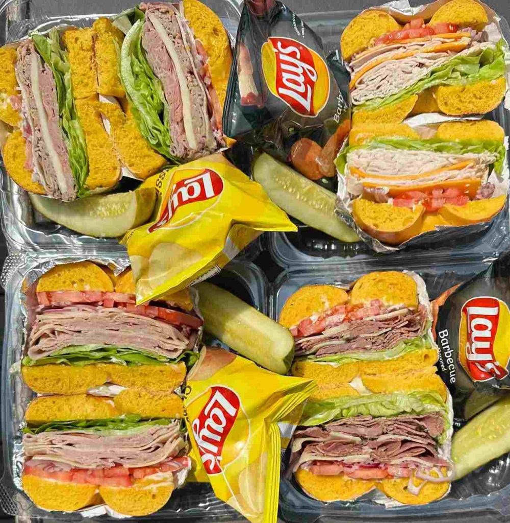 Individual boxed lunch and breakfast catering Central NJ with deli bagel sandwiches, chips, and pickles from Fast Bagel