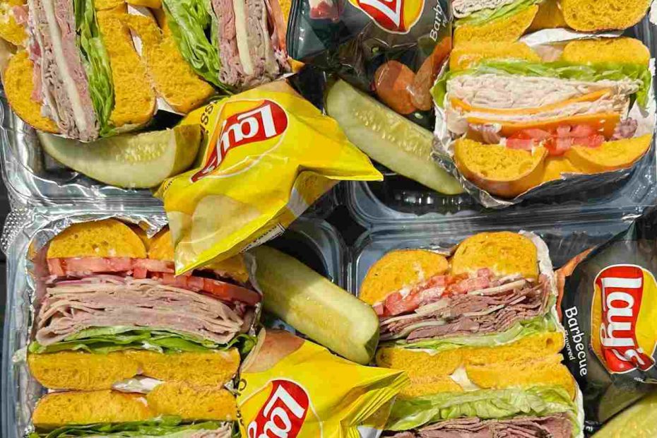 Individual boxed lunch and breakfast catering Central NJ with deli bagel sandwiches, chips, and pickles from Fast Bagel
