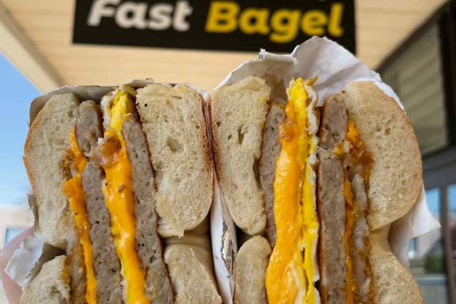 Loaded two-egg sausage and cheese breakfast sandwiches Central NJ served under the Fast Bagel storefront sign