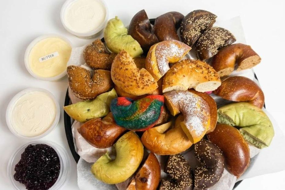 Bagel catering for groups with assorted bagels, butter and cream cheese spreads.