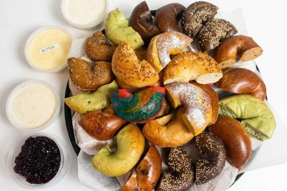 Bagel catering for groups with assorted bagels, butter and cream cheese spreads.